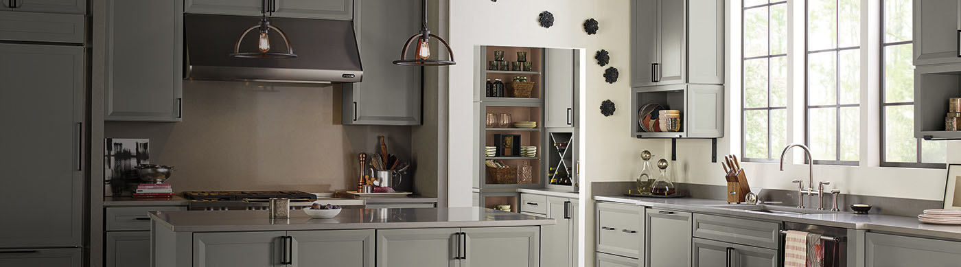 Make your mark with Diamond Cabinets like this cabinet and butler pantry in medium gray narrow-rail shaker cabinets.